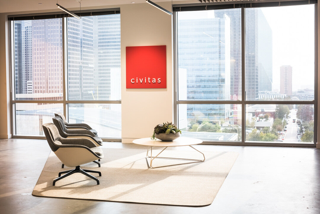 Civitas office lobby with modern seating and downtown skyline views, commercial photography Dallas, Texas