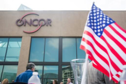 Oncor corporate building with American flag, commercial event photography Dallas, Texas