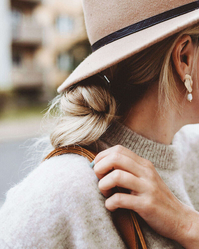 Stylish woman in a felt hat and knit sweater, lifestyle personal branding photography in Dallas, Texas by David Loi Studios