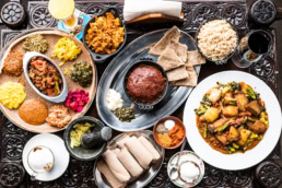 Ethiopian food spread with injera, stews, and spices, commercial food photography Dallas, Texas