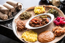 Ethiopian injera platter with stews and sides, food photography Dallas, Texas — David Loi Studios
