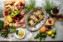 Elegant food spread with salmon, charcuterie board, and wine, commercial food photography Dallas, Texas
