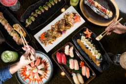 Japanese sushi and seafood spread with nigiri, maki rolls, and crab, food photography Dallas, Texas