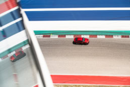 Red Cadillac on track at Circuit of the Americas, automotive photography Austin, Texas