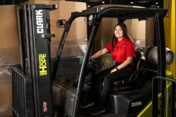 Equipment Depot worker on Clark forklift, industrial photography Dallas, Texas