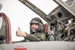 Fighter pilot giving thumbs up in cockpit, AQRD aerospace photography Fort Worth, Texas