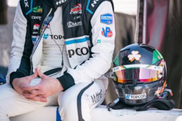 Indy Lights racing driver with Topcon helmet and firesuit, motorsport photography Dallas, Texas