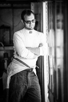 Racing driver in OMP suit at ReGoGo Racing, Motorsports Ranch portrait photography Fort Worth, Texas