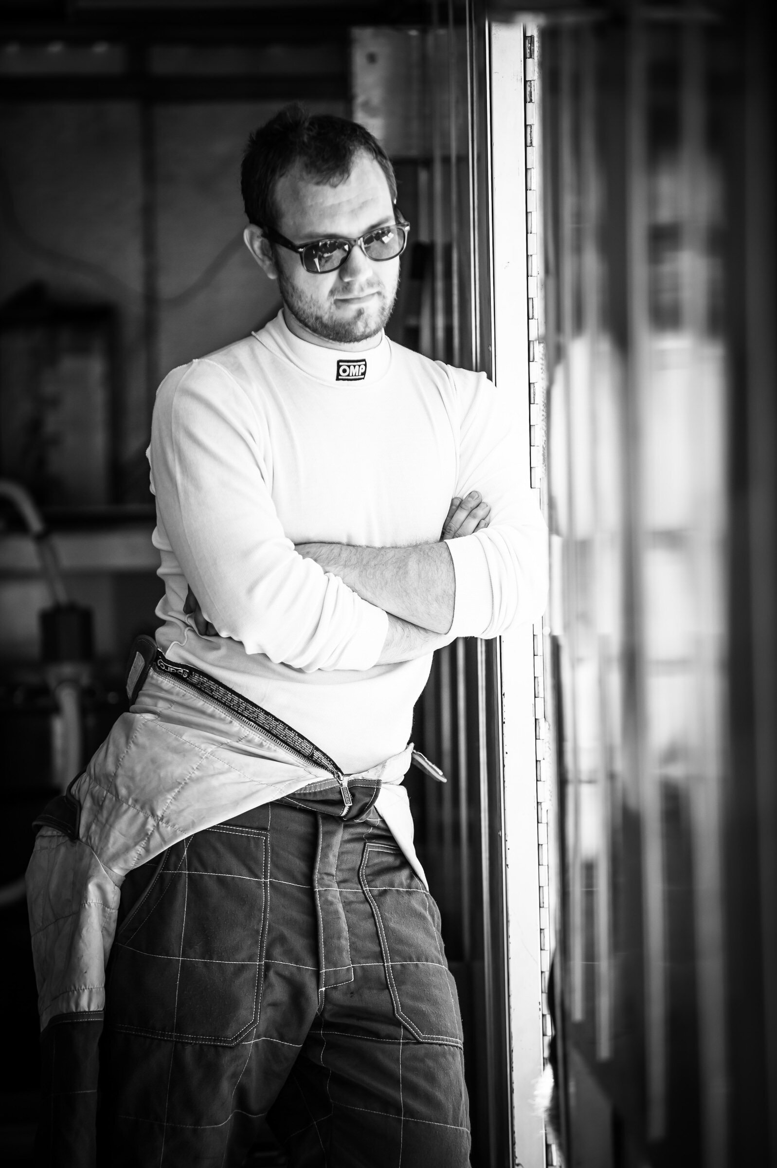 Racing driver in OMP suit at ReGoGo Racing, Motorsports Ranch portrait photography Fort Worth, Texas