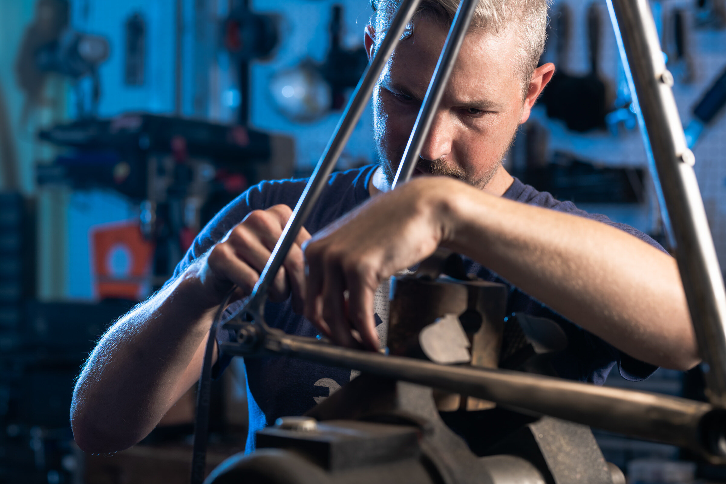 Skhul Bicycles craftsman hand-building titanium bike frame, industrial photography Dallas, Texas