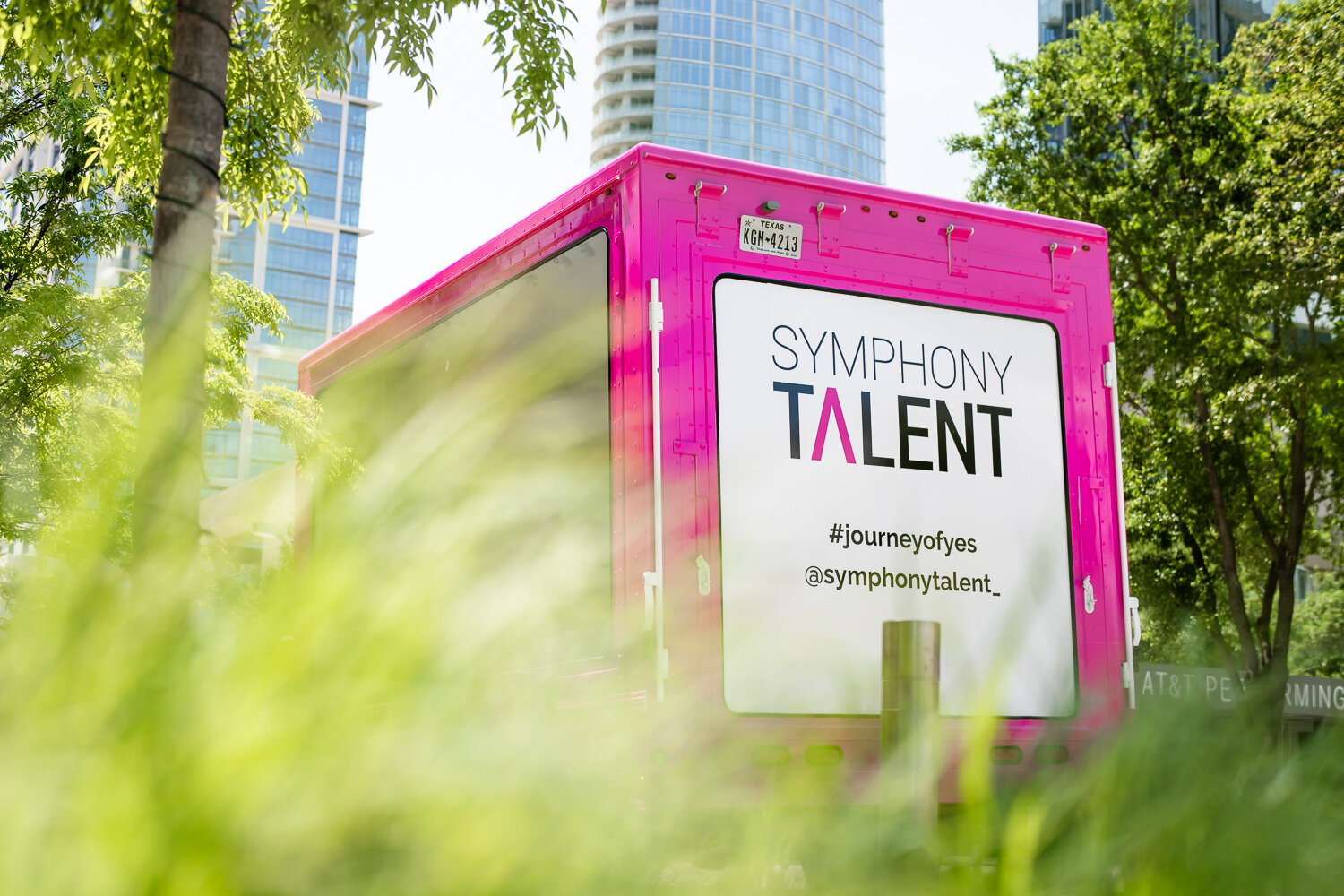 Symphony Talent pink branded trailer with #journeyofyes, commercial photography Dallas, Texas