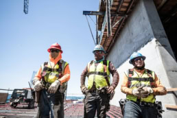TAS Concrete construction workers in safety gear, industrial photography Houston, Texas
