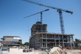 TAS Concrete high-rise construction site with tower cranes, commercial photography Houston, Texas