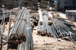 Steel rebar bundles at TAS Concrete construction site, industrial photography Houston, Texas