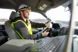 Topcon construction worker driving Ford truck at Spring Mountain Motorsports Ranch, industrial photography Fort Worth, Texas
