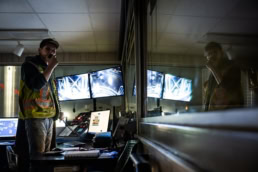 Topcon control room operator monitoring screens, industrial photography Fort Worth, Texas