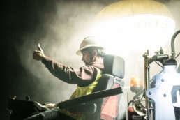 Topcon heavy equipment operator giving thumbs up, industrial photography Fort Worth, Texas