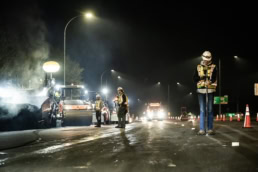 Topcon surveying equipment used during nighttime road paving, industrial photography Fort Worth, Texas