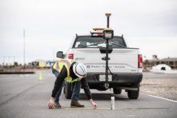 Topcon surveyor measuring road with Ford F-150 and GPS equipment, industrial photography Fort Worth, Texas