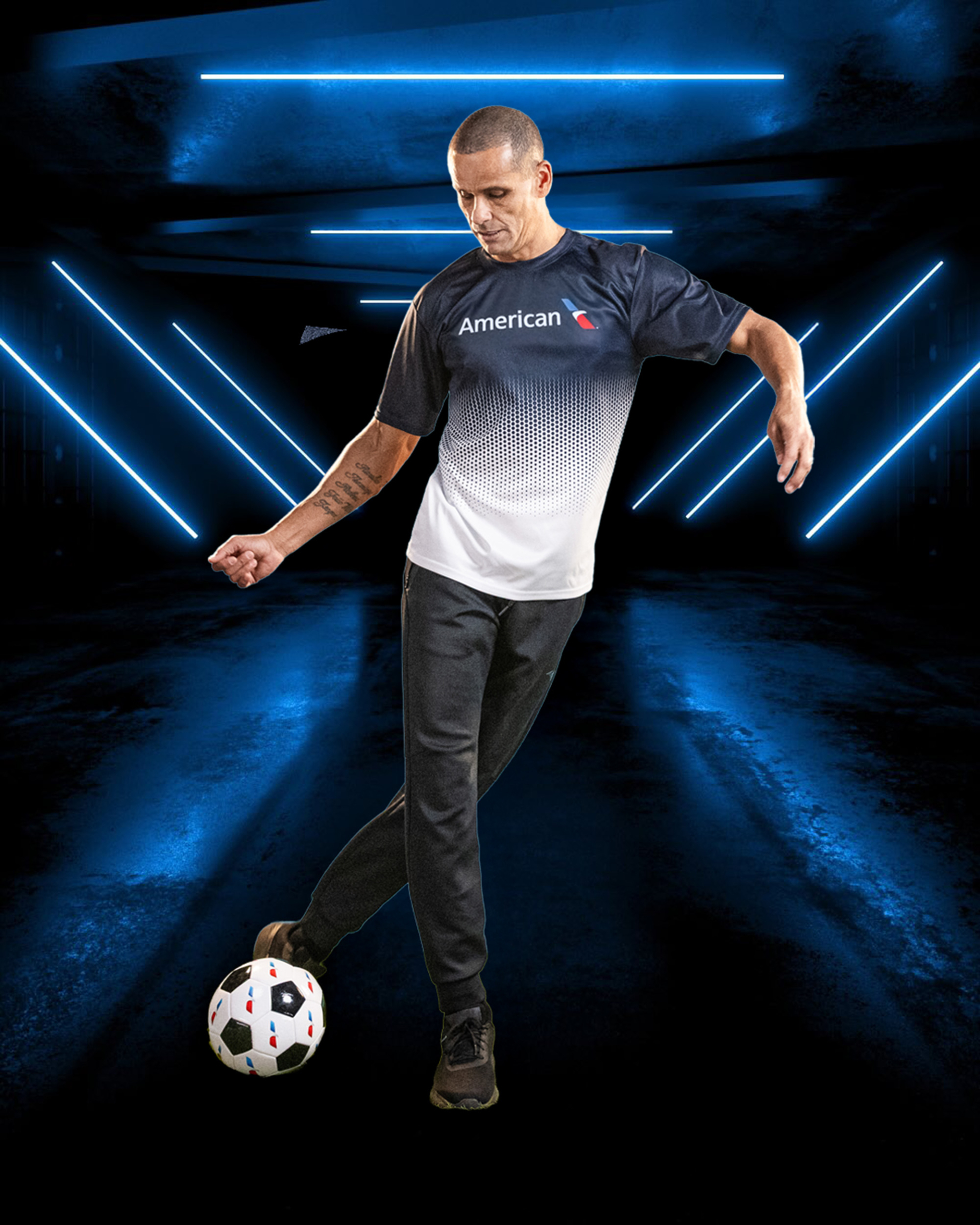 Clint Dempsey in American Airlines jersey kicking ball, commercial portrait photography Dallas, Texas