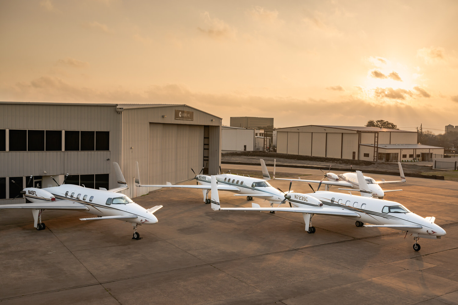 Beechcraft Starship formation parked on ramp at AQRD hangar, aerospace photography Fort Worth, Texas