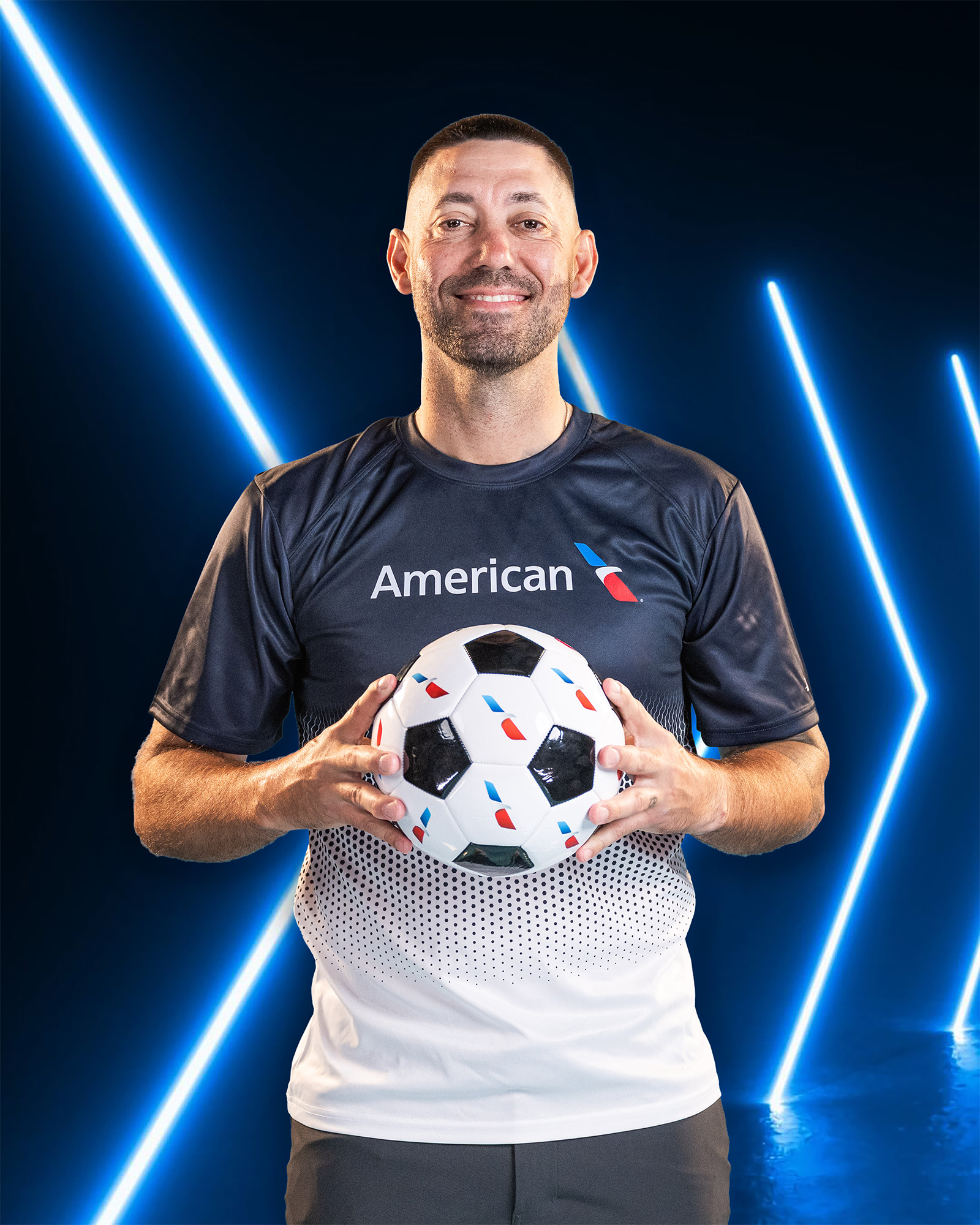 Clint Dempsey holding soccer ball for American Airlines commercial portrait photography Dallas, Texas