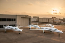 Learjet fleet parked on ramp at AQRD hangar, aerospace photography Fort Worth, Texas