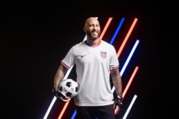 Tim Howard in USA soccer jersey holding ball, American Airlines x US Soccer commercial photography Dallas, Texas