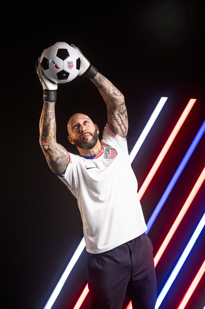 Tim HowardUS Soccer goalkeeper in USA jersey holding ball, American Airlines x US Soccer commercial photography Dallas, Texas