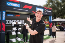 Aramco Formula 1 fan zone attendee giving thumbs up at COTA, event photography Austin, Texas