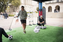 Aramco soccer kick activation at event, event photography Dallas, Texas