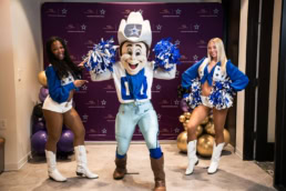 Dallas Cowboys cheerleaders and Rowdy mascot at corporate event, event photography Dallas, Texas