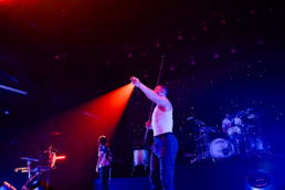 Imagen Dragons performing on stage with band at live concert event photography Dallas, Texas