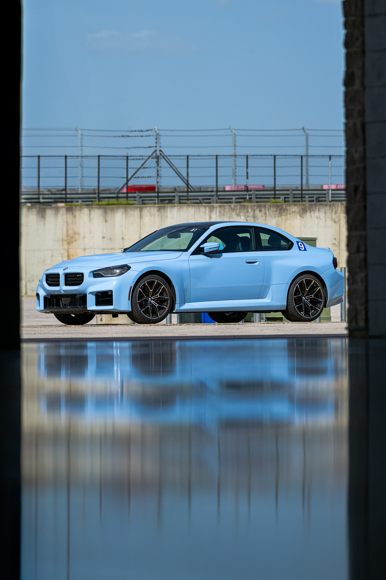 Light blue BMW M2 with number 9 at Circuit of the Americas, automotive photography Austin, Texas