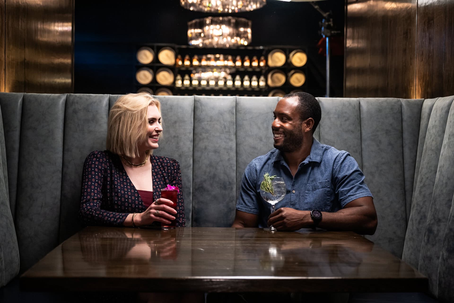Guests enjoying craft cocktails in a lounge, hospitality and experience lifestyle photography in Dallas, Texas by David Loi Studios