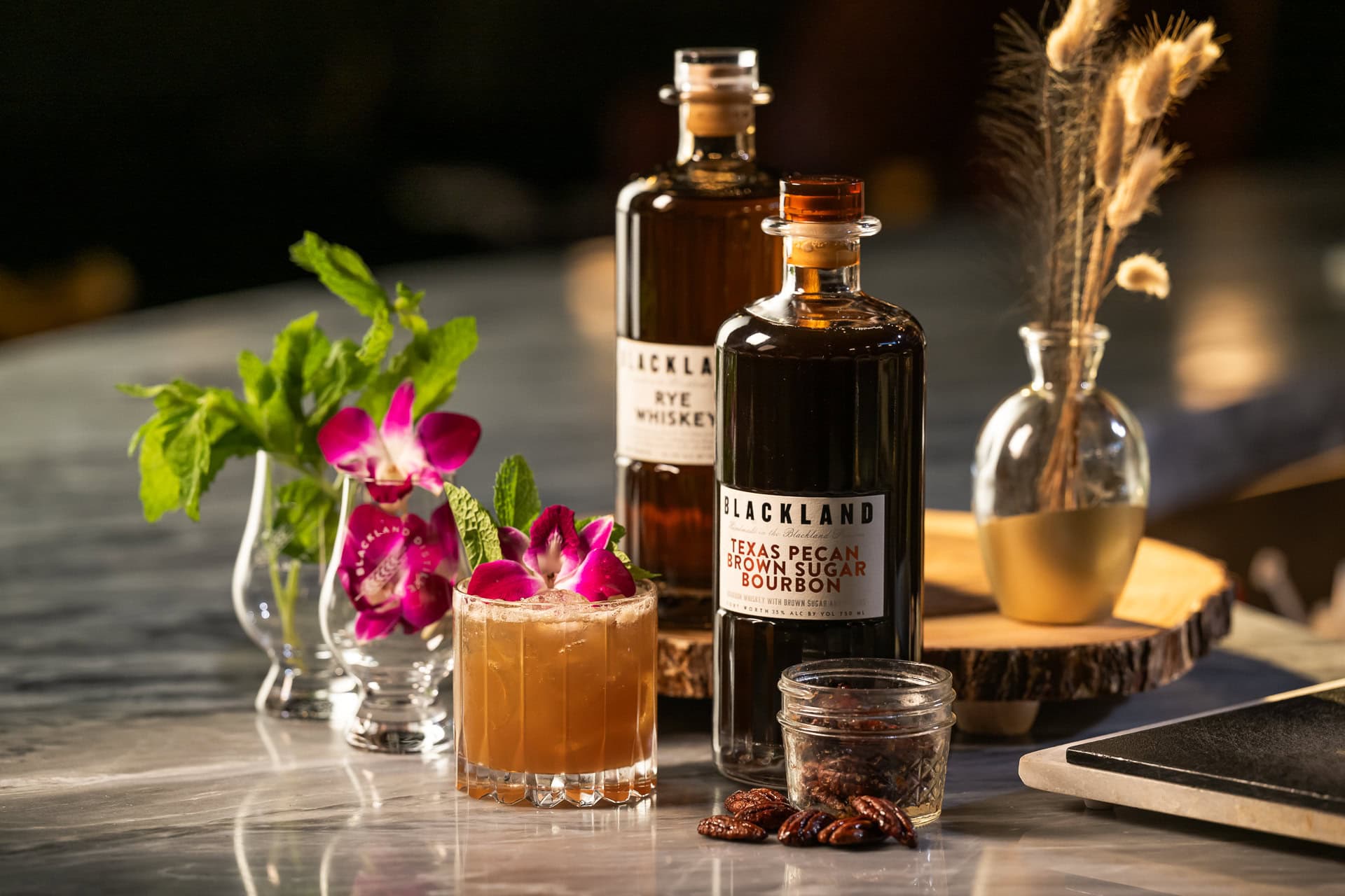 Two bottles photographed together as a product group, packaging and group product photography in Dallas, Texas by David Loi Studios