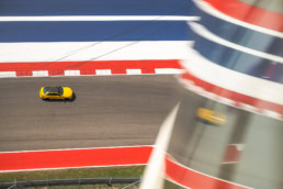 Yellow BMW M4 on track at Circuit of the Americas, automotive photography Austin, Texas