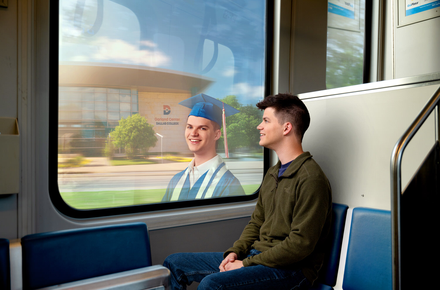 Dallas College Future-Self ad campaign, student sees graduate reflection in DART train window, Dallas, Texas