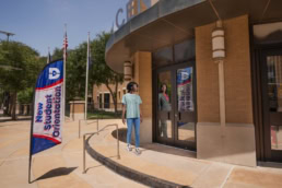 Dallas College Future-Self ad campaign, student approaching new student orientation entrance, Dallas, Texas