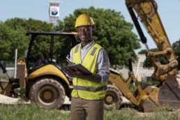 Dallas College Future-Self ad campaign construction worker with backhoe, commercial photography Dallas, Texas