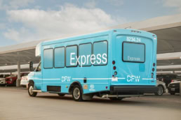 DFW Airport Express shuttle bus in parking lot, commercial photography Dallas, Texas
