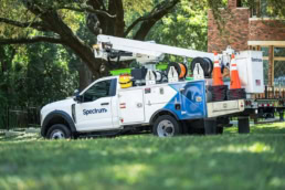 Spectrum Ford F-550 bucket truck with boom and cable reels, commercial photography Dallas, Texas