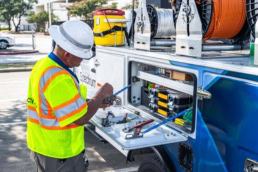 Spectrum technician working at service truck, industrial commercial photography Dallas, Texas