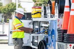 Spectrum utility technician working at service truck, industrial photography Dallas, Texas