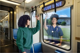 Dallas College ad campaign student on Blue Line train sees nurse reflection, commercial photography Dallas, Texas