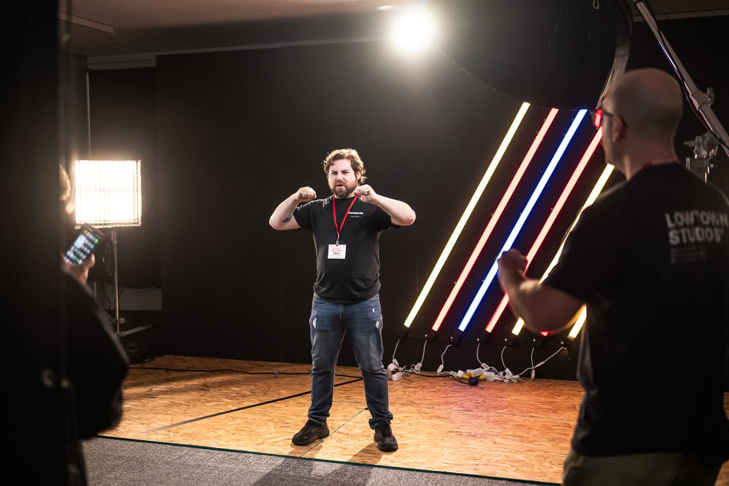 Behind the scenes FIFA Dallas shoot, photographer directing athlete in studio, Dallas, Texas