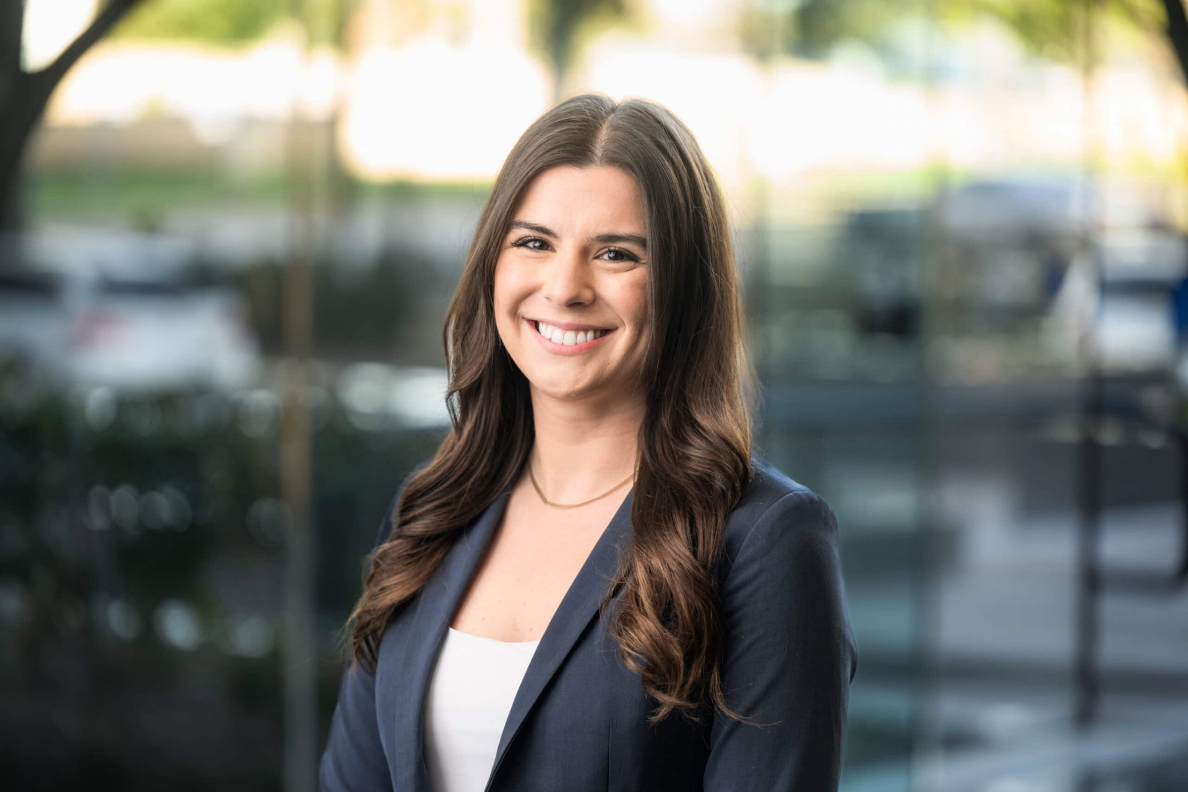 Corporate headshot of a professional woman in a navy blazer, headshot photography in Addison, Texas by David Loi Studios