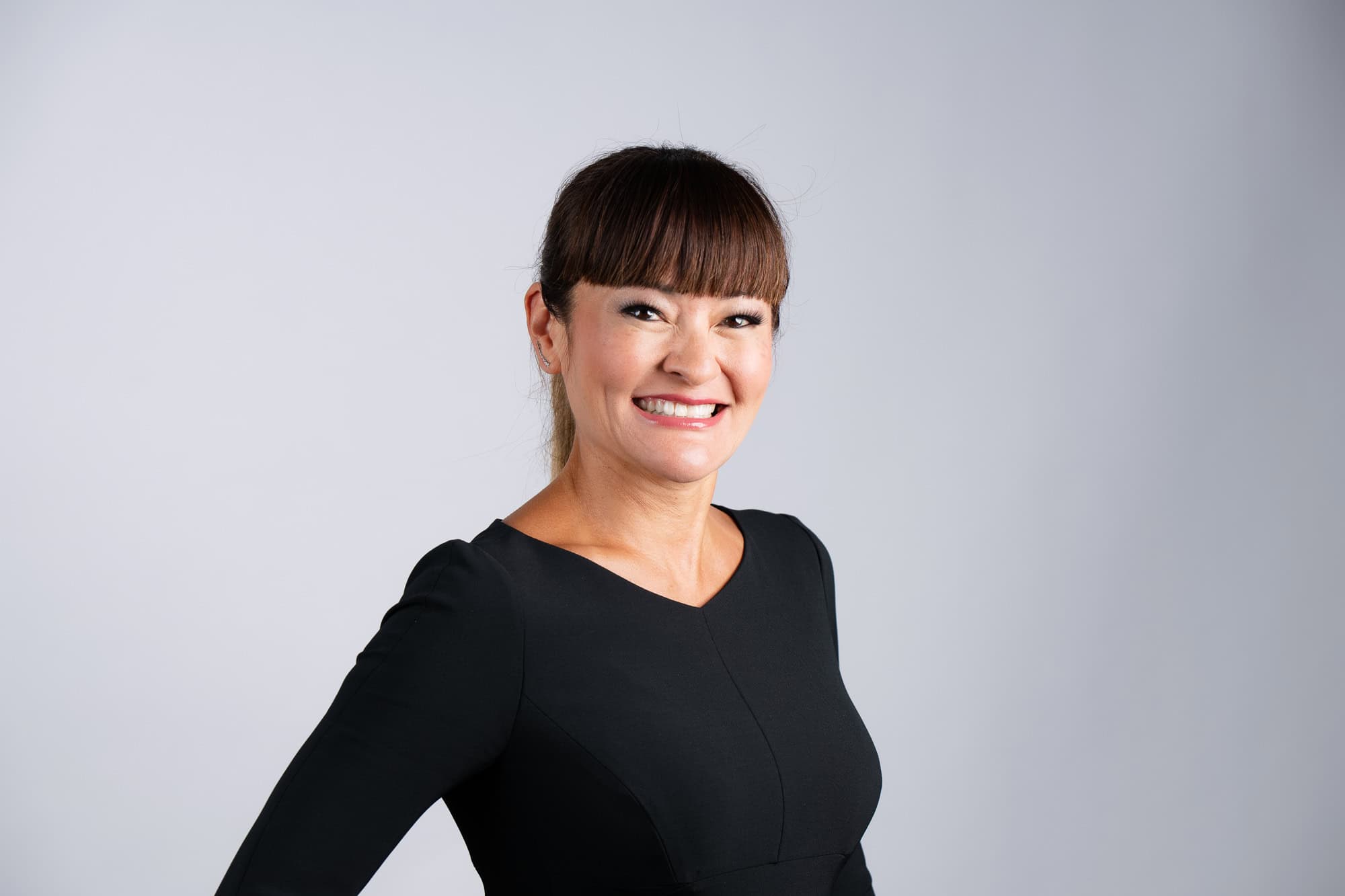 Professional woman in black dress, corporate portrait photography Dallas, Texas