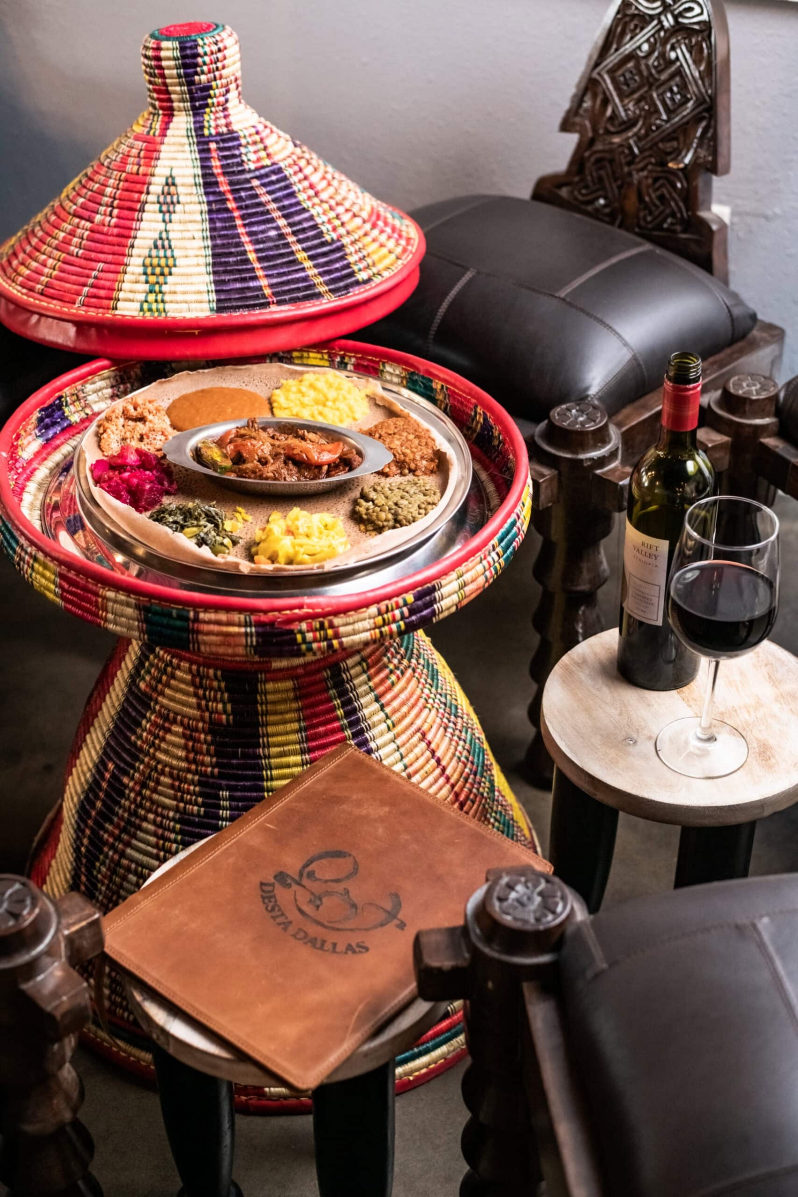 Close detail of a plated dish and glassware on the table, detail and macro photography for hospitality brands in Dallas, Texas by David Loi Studios
