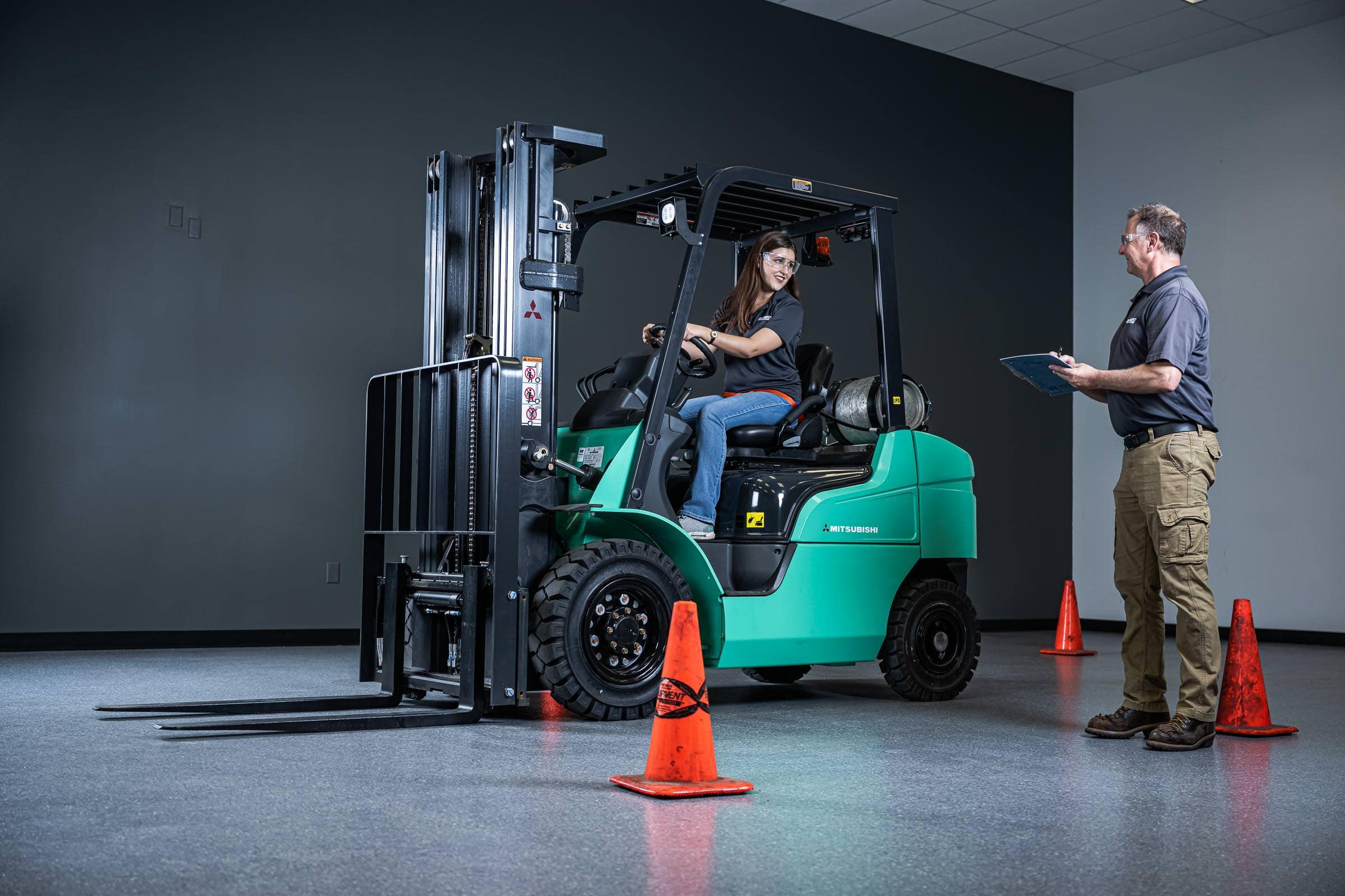 Forklift operator training with safety cones, industrial photography serving Irving, Texas by David Loi Studios